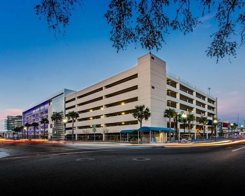 Exterior photo of Baptist parking structure at dusk